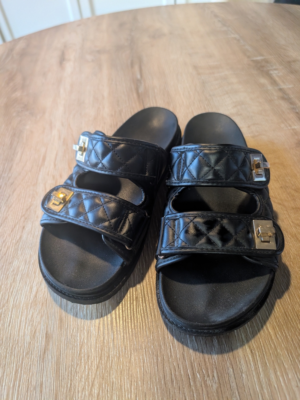 Quilted Black Double-Strap Slide Sandals with Silver Buckle Accents